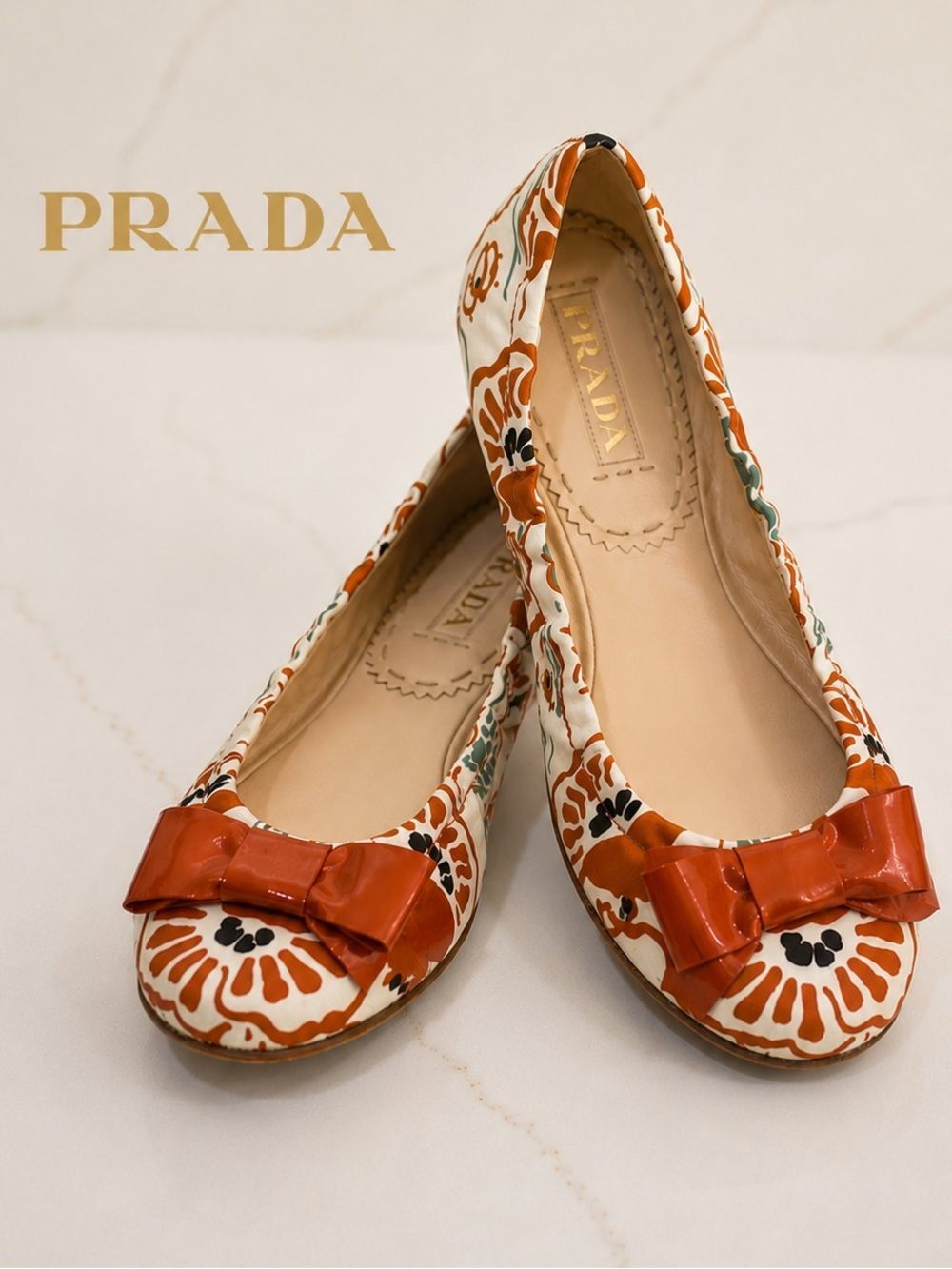 Prada Floral Print Ballet Flats with Patent Leather Bow | Made in Italy